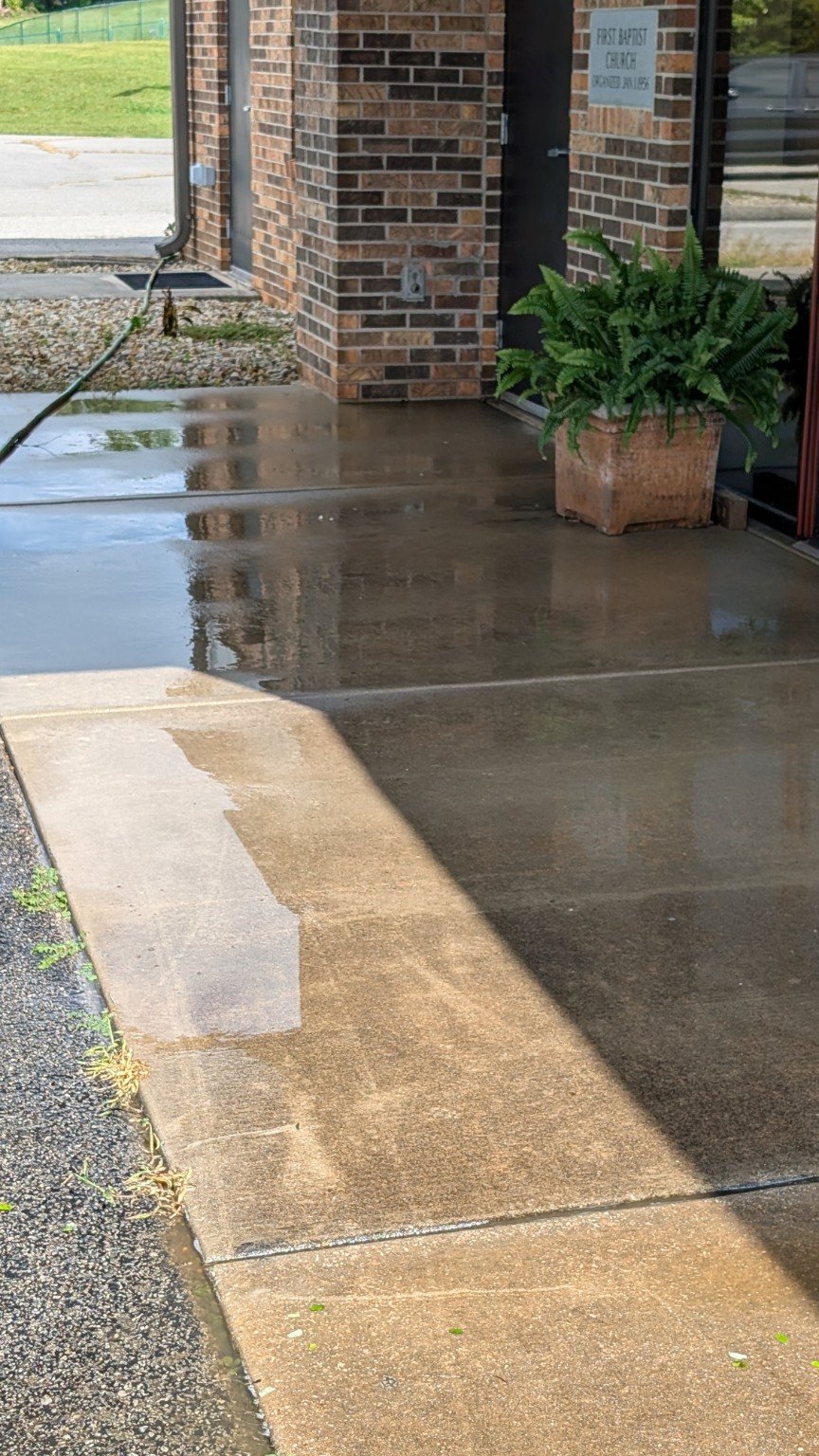 Cleaned commercial concrete entrance by D & T Pressure Washing