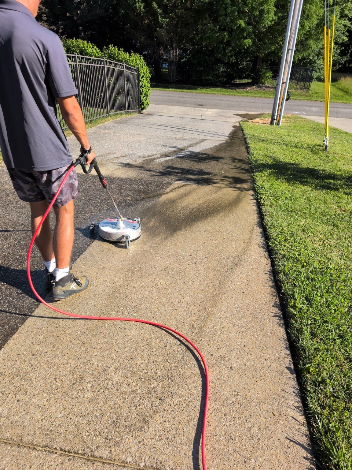 Surface cleaner in action on driveway