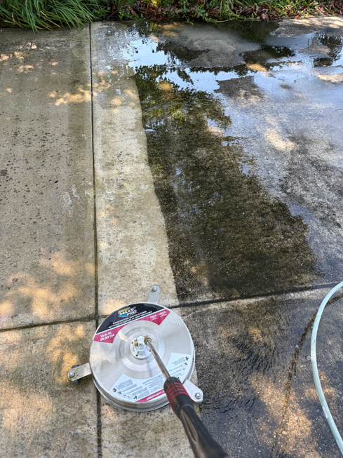 Surface cleaner showing a dramatic clean and dirty concrete contrast